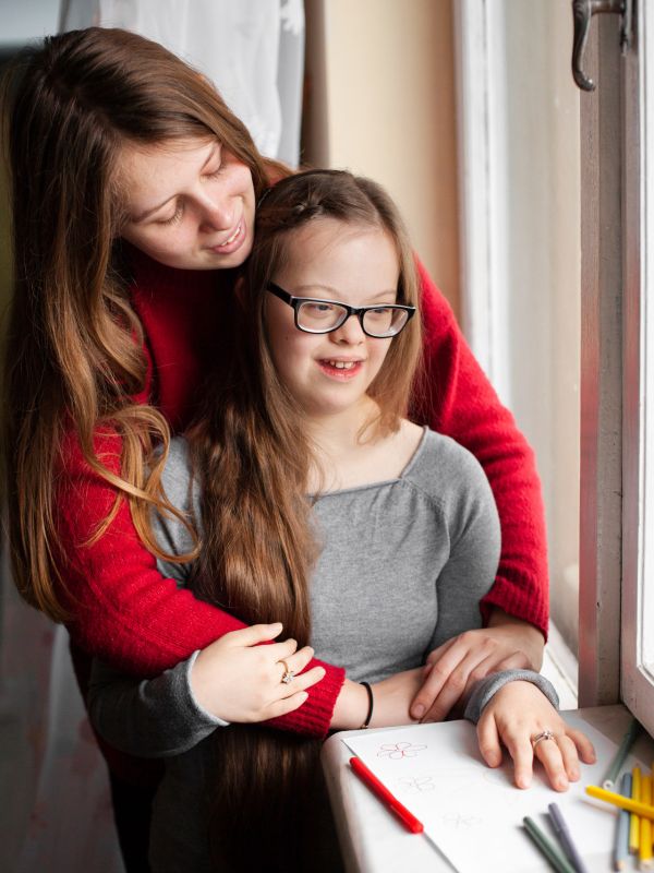 woman-girl-with-down-syndrome-posing-by-window